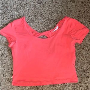 It’s a hot pink crop top shirt